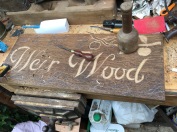 Carving the Weir Wood sign